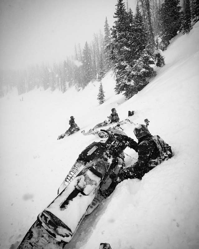 sidehilling in powder snowmobiling in montana