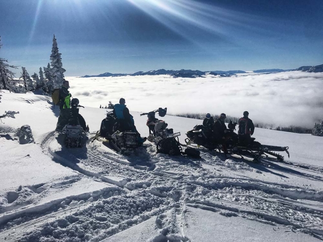 group on plain powder snowmobiling in montana
