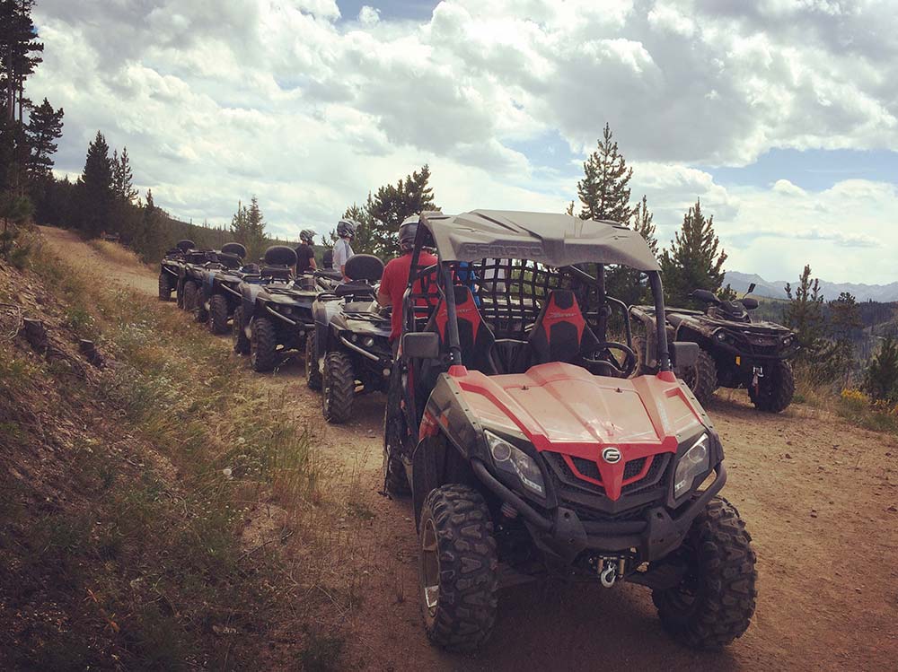 convoy of side by sides on montana trail