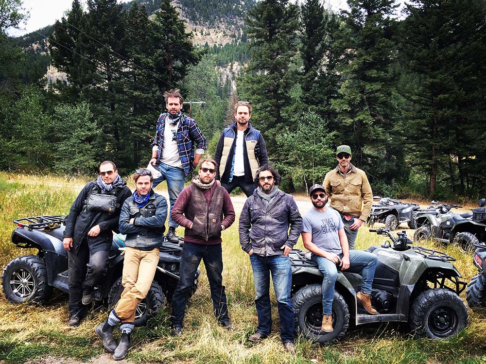 friends standing cool on their atvs on montana trail