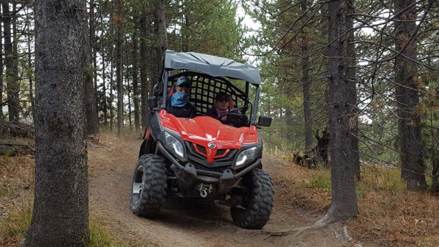 side by side sidehilling on montana trail in forest