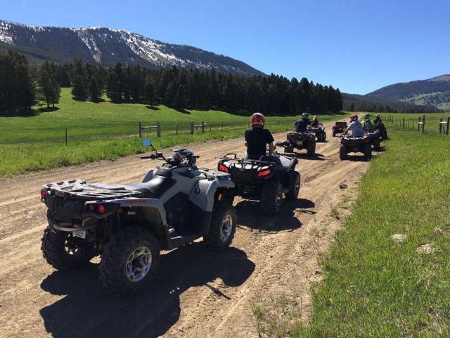 Convoy of side by sides on montana mountain road